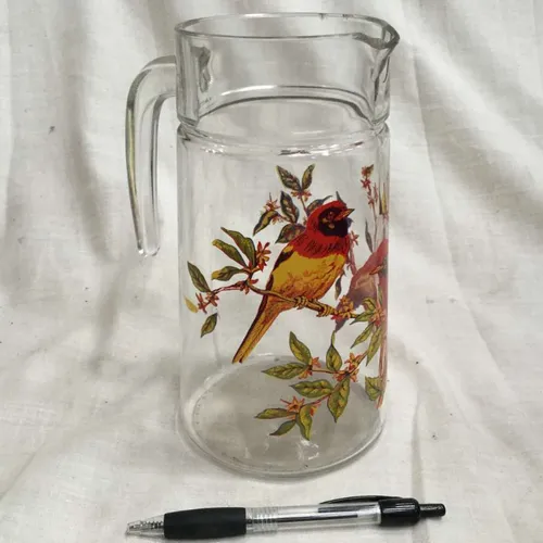 Clear glass jug with bird on a branch design