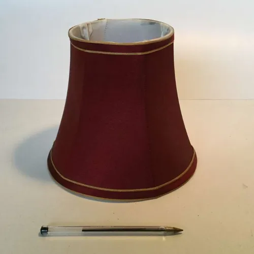 dark red period lampshade with gold trim at top and bottom