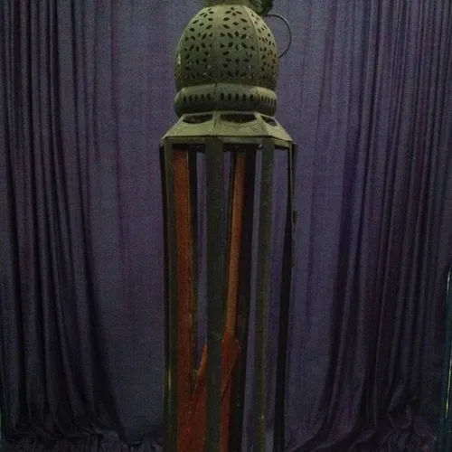 black metal Moroccan lantern with orange glass