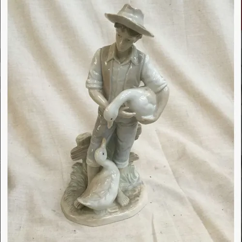 Ceramic Man with Geese figurine