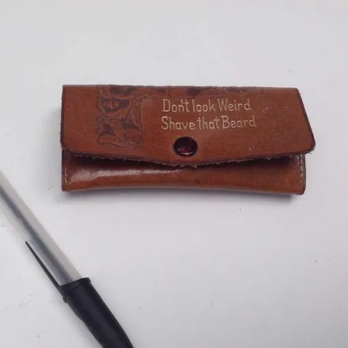 brown leather case with brown Bakelite razor