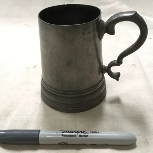 Thin, unpolished metal tankard