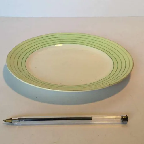 white side plate with pale green rim with thin dark green stripes