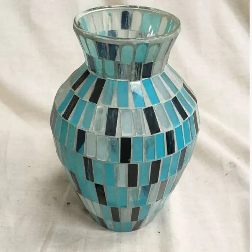 Glass vase with mosaic tiles in varying blue shades