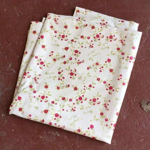 beige oil tablecloth with red floral design