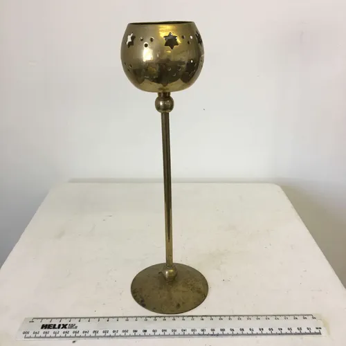 Gold tulip style candlestick with cut out stars design