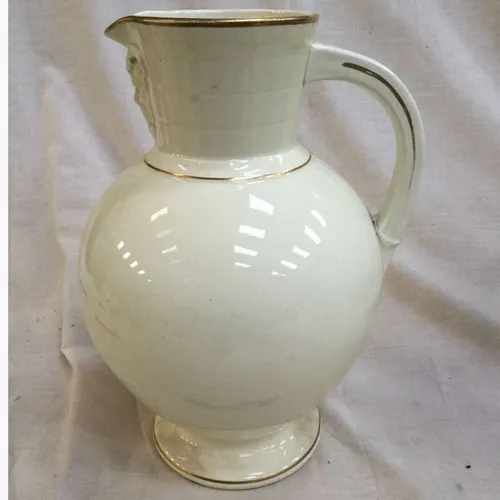 Glazed white jug with gold trim