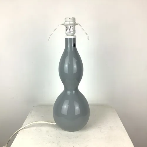 Tall, light grey table lamp