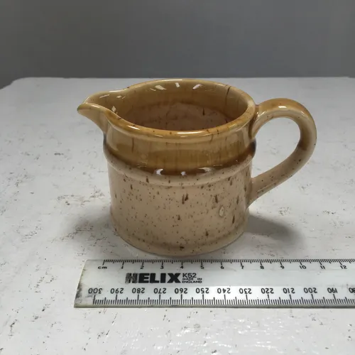 Small Glazed Cream and Tan Speckled Stoneware Milk Jug