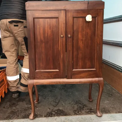 Dark wood cupboard with legs