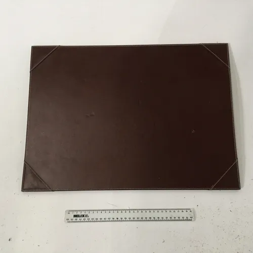 Various brown and black leather desk blotters