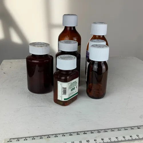 Quantity of brown plastic medicine bottles