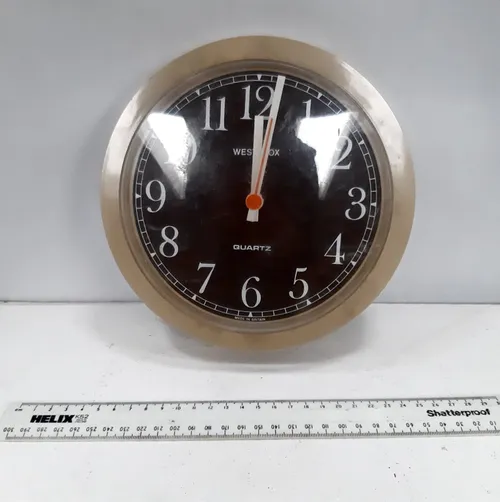 Westclox plastic analogue wall clock with faux wooden face and tan plastic rim