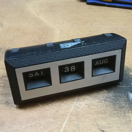 Black plastic perpetual desk calendar