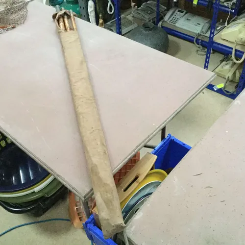 Wooden fishing rod in bag