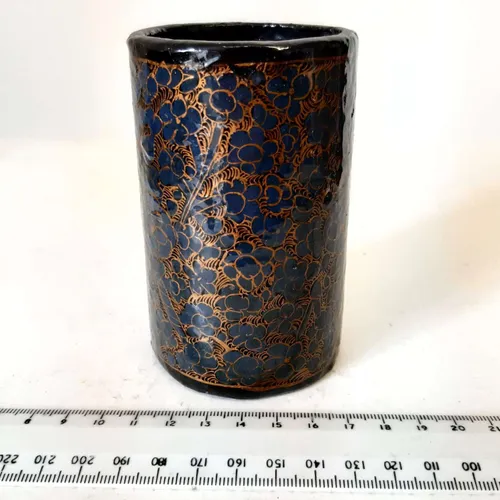 Black pen pot with gold and navy floral detail