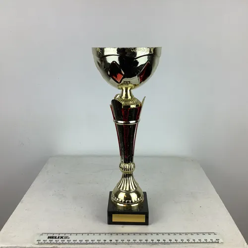 Red gold cup shaped modern trophy