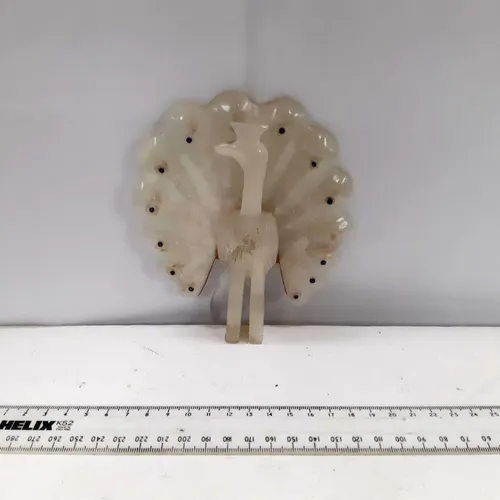 Ivory peacock ornament 