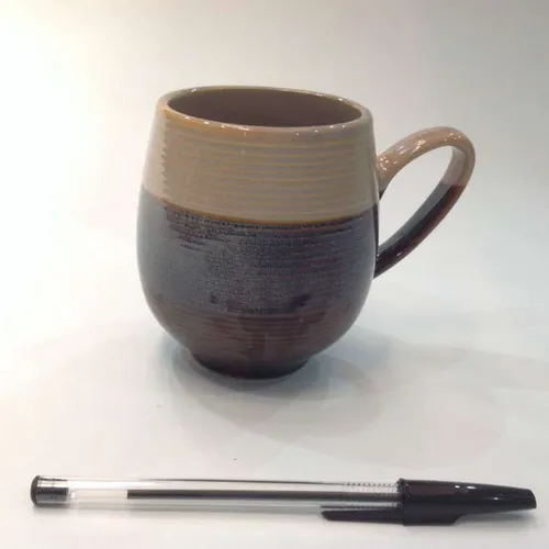 ceramic mug with tan and blue glaze