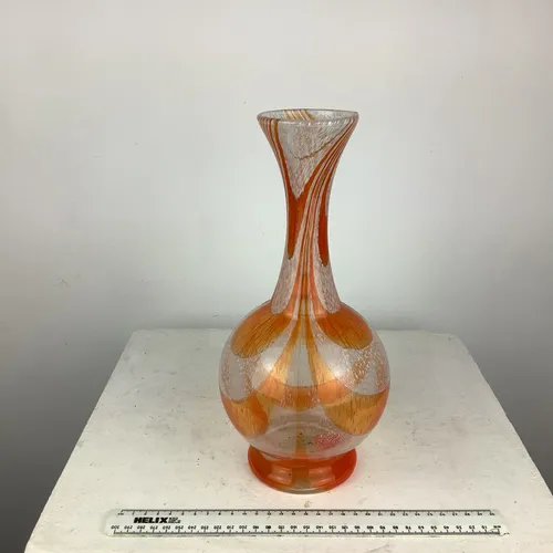 White and orange glass vase with thin neck/stem