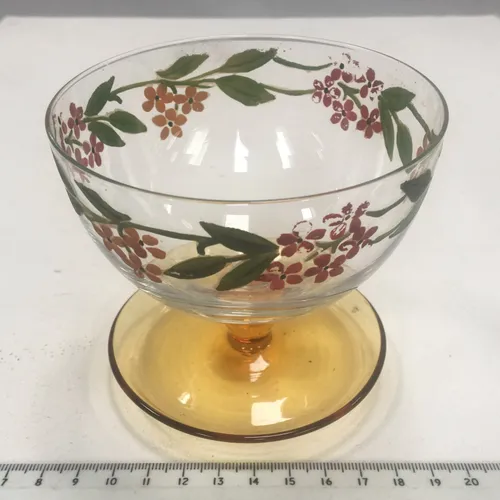 glass dessert bowl with yellow base and floral motif