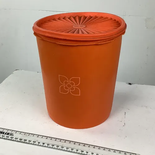 Period tall orange/cream Tupperware container
