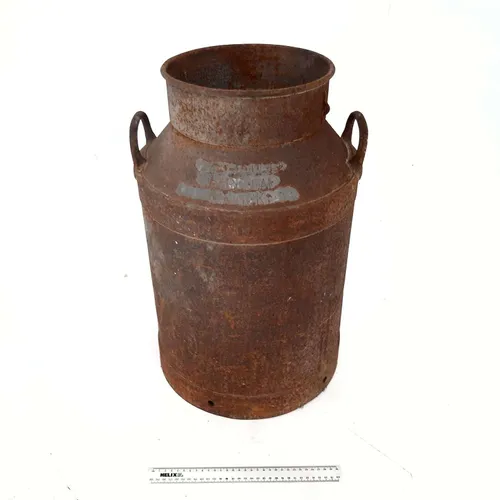 Rusted metal milk churn 