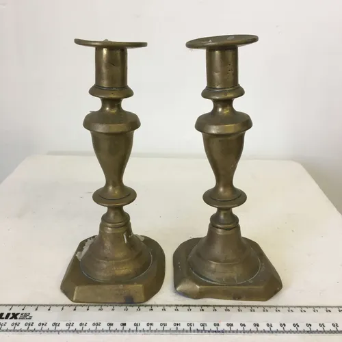 Pair of unpolished brass candlesticks