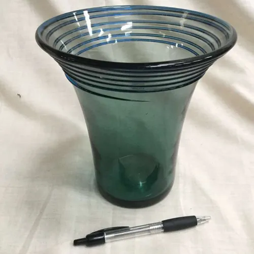 Green glass vase with blue swirl detail 