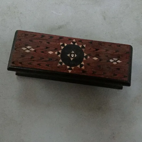 Rectangular red wood box with patterned lid