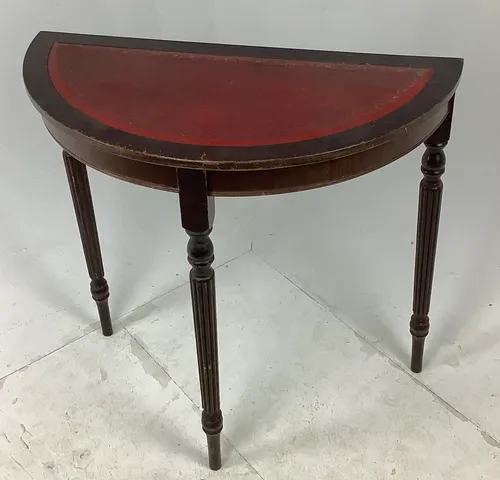 dark wood half moon table with red leather top