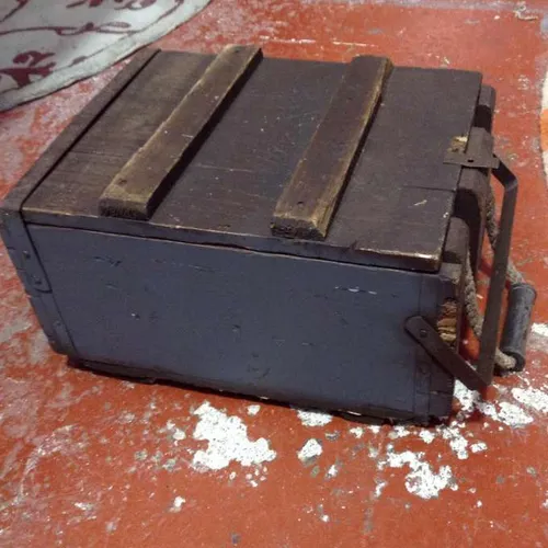 wooden ammunition box blue rope