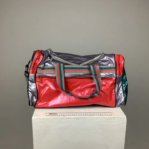 Red, Green and silver Metallic coloured Plastic Holdall / Bag