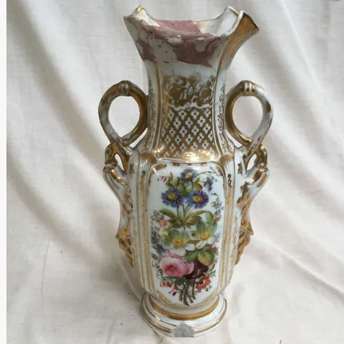White and gold china vase with flower design and handles