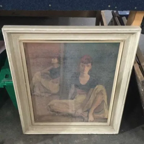 Painting of woman sitting in white frame