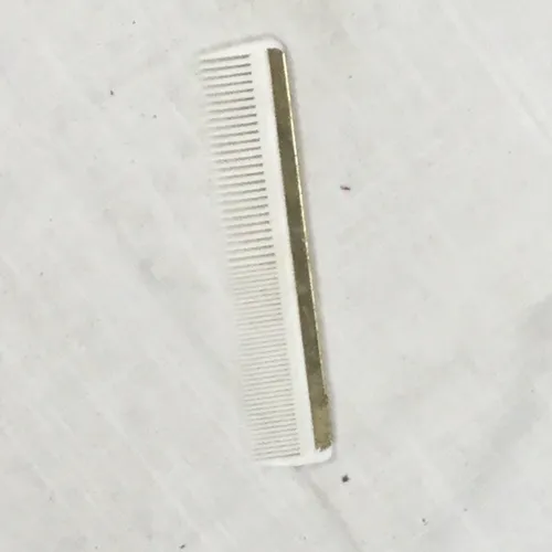 White comb with gold edge 