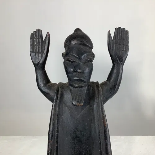 Carved, Dark Wood “Man with Hands up” figurine