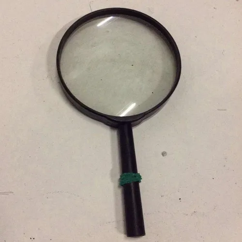 Small plastic magnifying glass with black frame