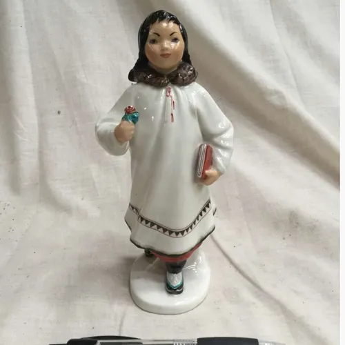 Lomonosov Russian Eskimo girl with book and flower porcelain figurine