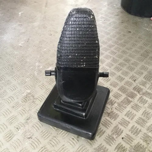 Black period style prop microphone on stand 