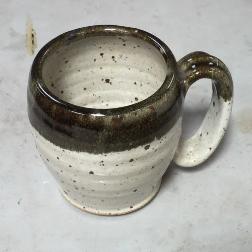 Speckled ceramic green and white mug