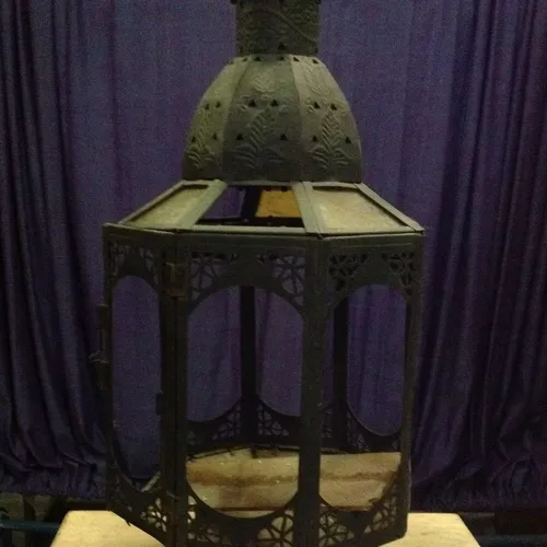 black metal Moroccan lantern with yellow glass