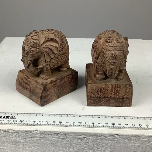 Carved stone elephant book ends
