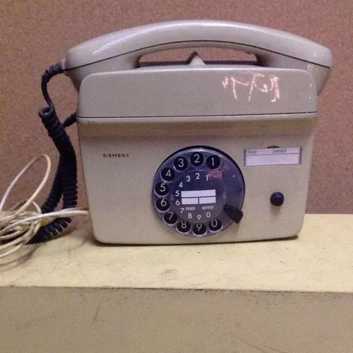Period Siemens rotary dial telephone in beige
