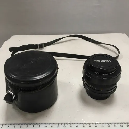 Minolta 28mm camera lens with case
