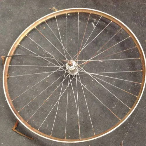 rusty single / spare bicycle wheel