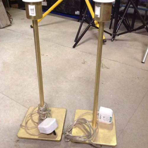 brass coloured metal stick lamp with square base