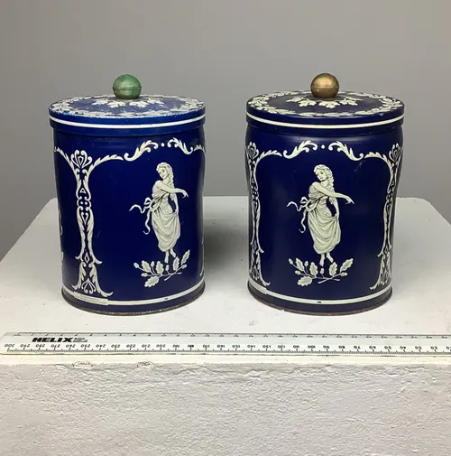 Tall blue tins with white decoration