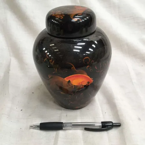 Dark black ginger jar with sunset decoration