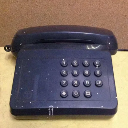 blue / grey BT Tribune push button telephone with paint splatter